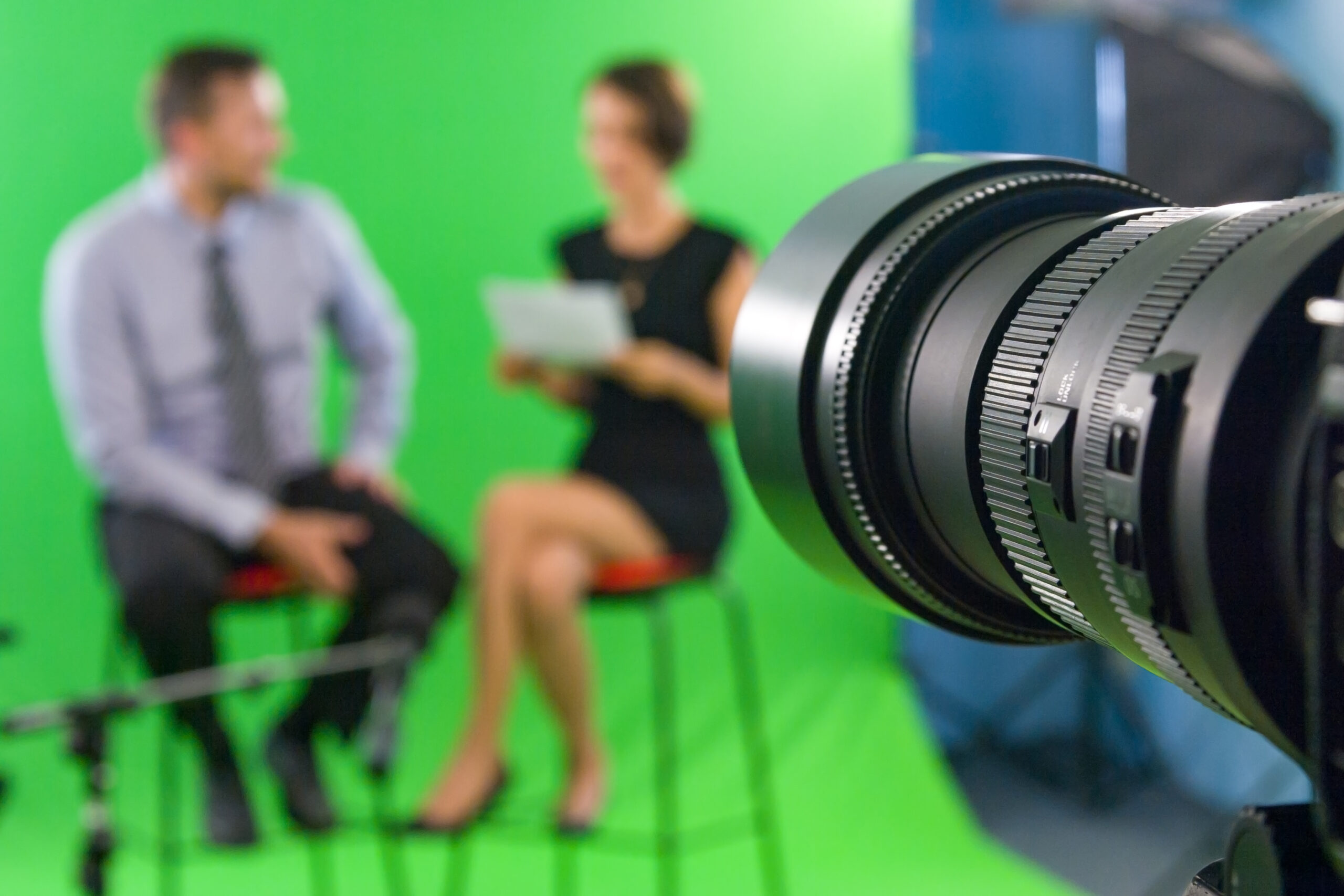 Recording live talk show between journalist and star at tv green screen studio